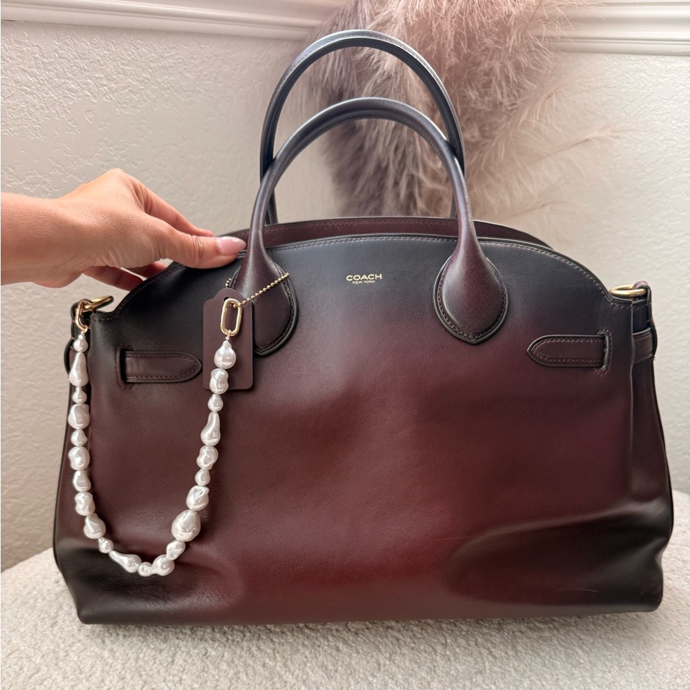 Highly sought after and sold out Merlot Coach Empire 40 bag, like new